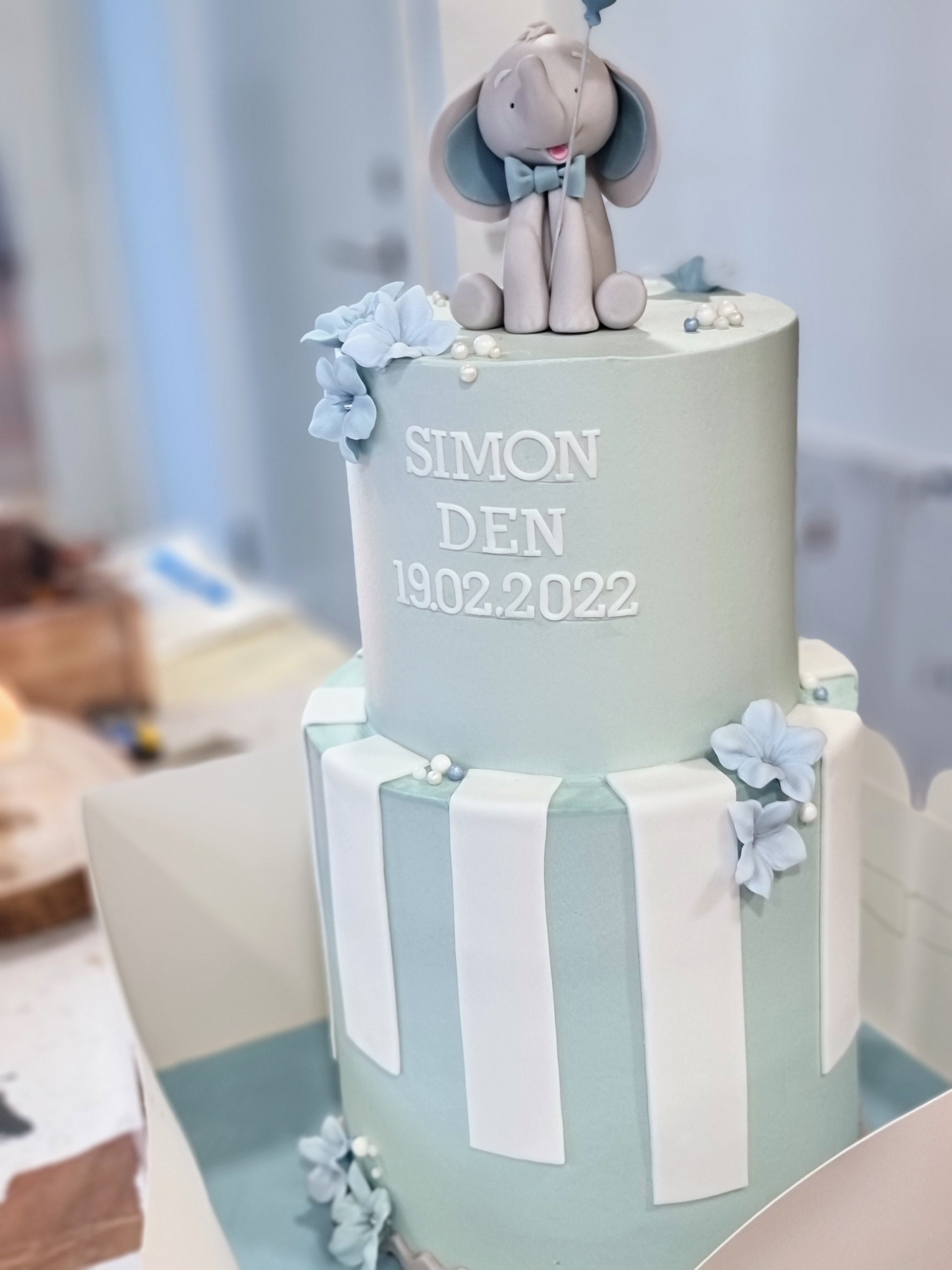 Christening cake with stripes and an elephant