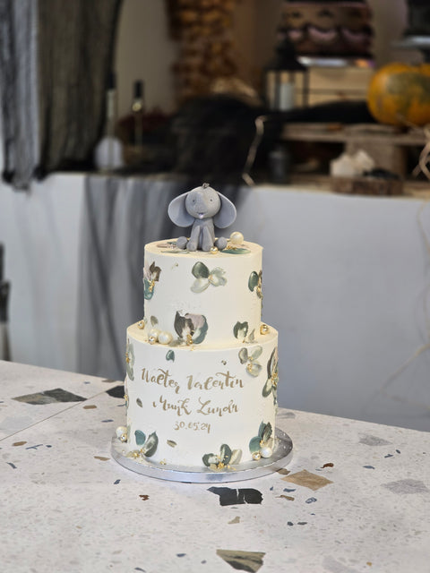 Christening cake with buttercream leaves