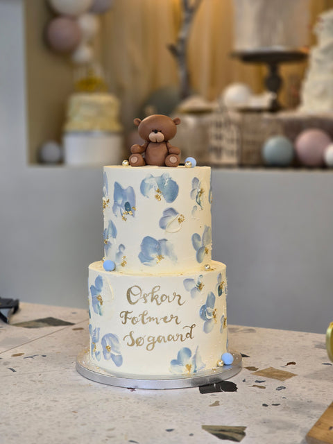 Christening cake with buttercream leaves