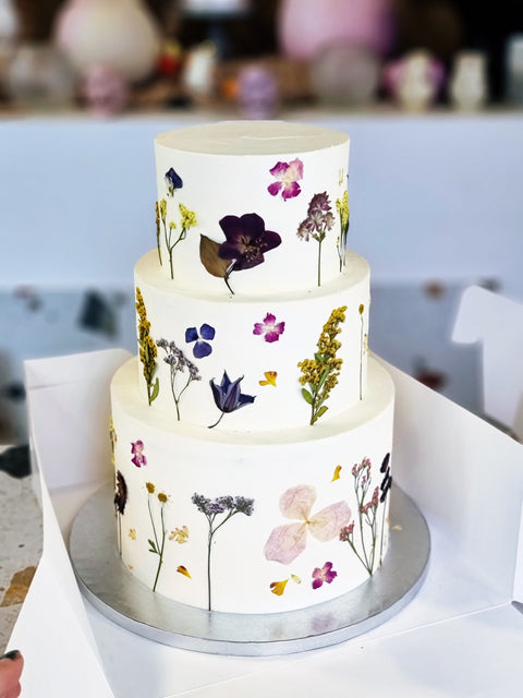 Festkage med pressede blomster